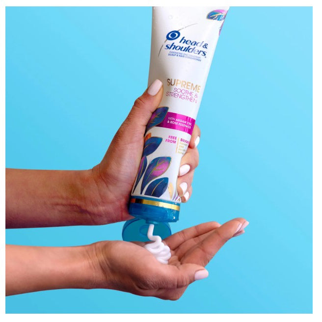 Tube of Head & shoulders supreme soothe & strengthen, sulfate-free conditioner with rose essence and argan oil. 