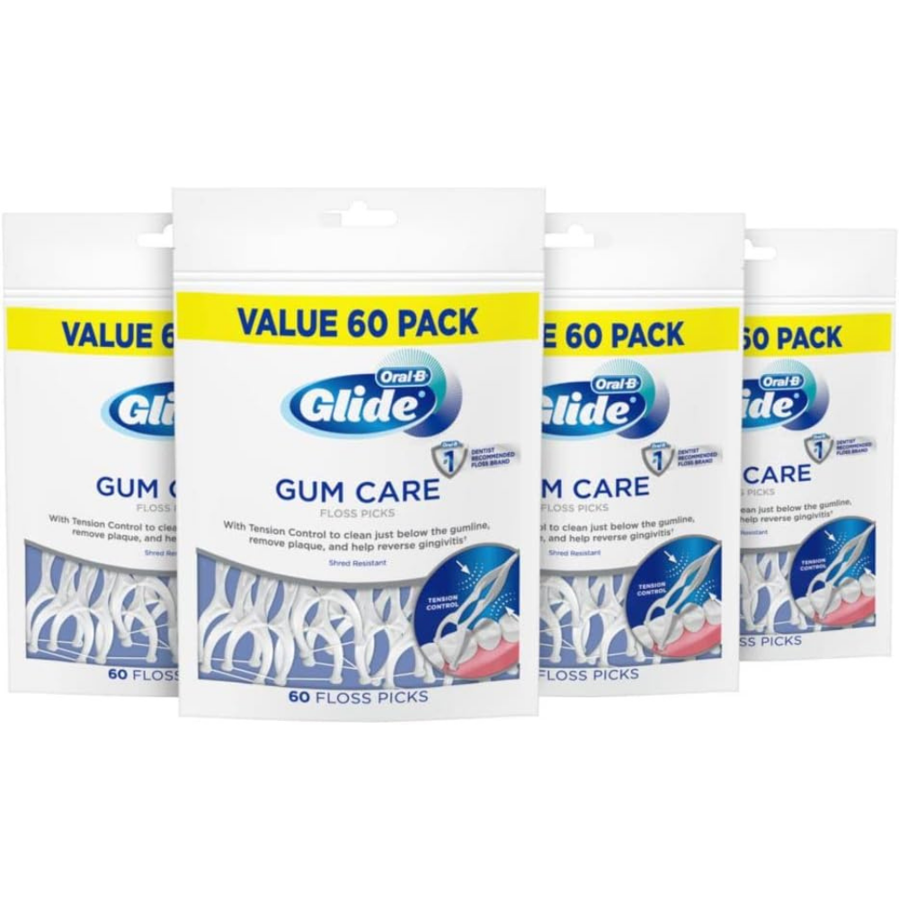 Four packages of Oral-B Glide Gum Care floss picks in mint flavour